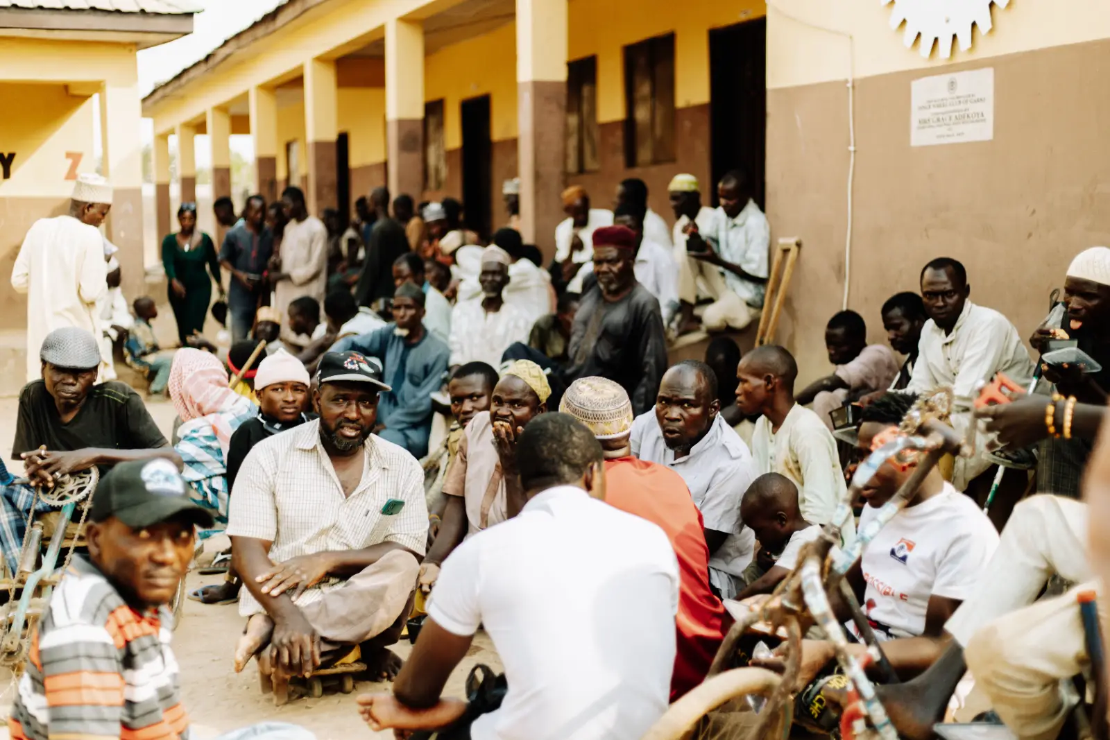 Voters waiting together outside a polling unit